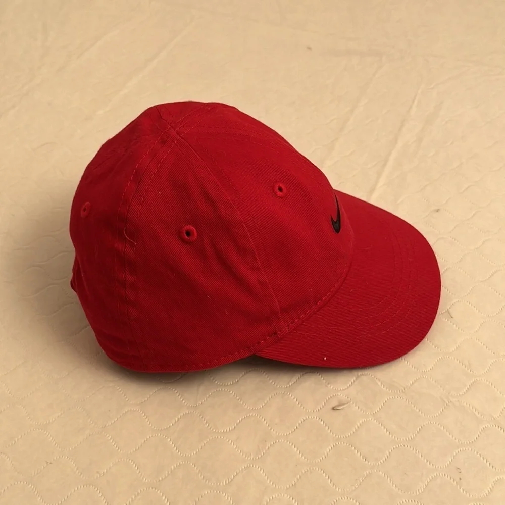 Nike red infant adjustable baseball hat with black swoosh
